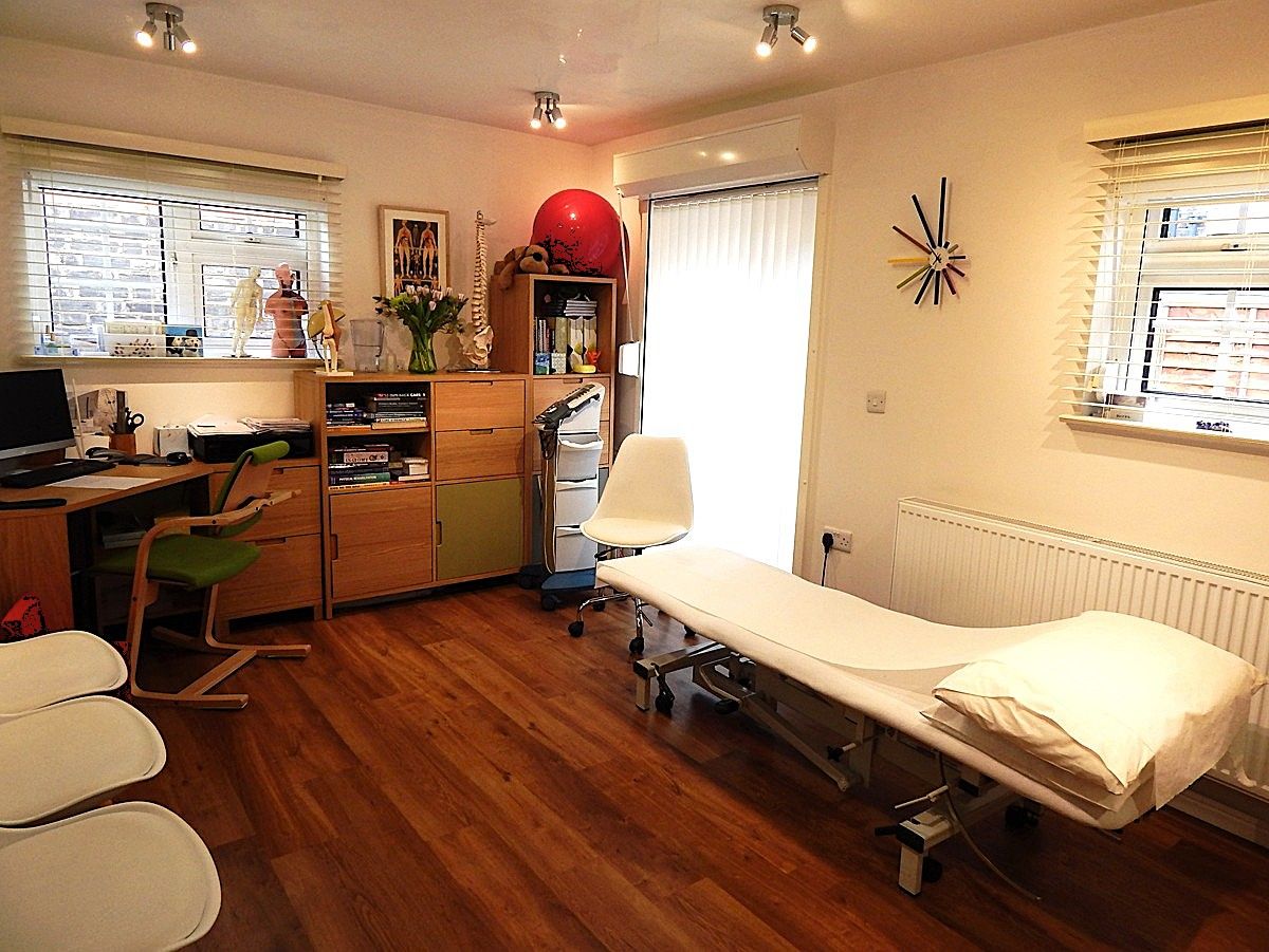 A calm private treatment room at Sutherland House
